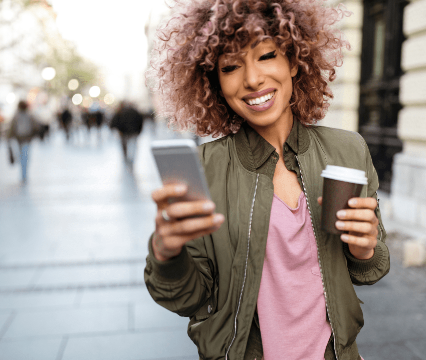a happy woman after trauma therapy